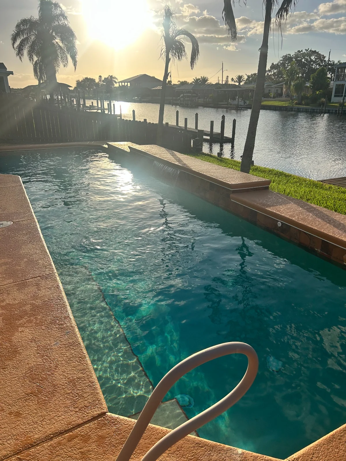 Waterfront pool at sunset