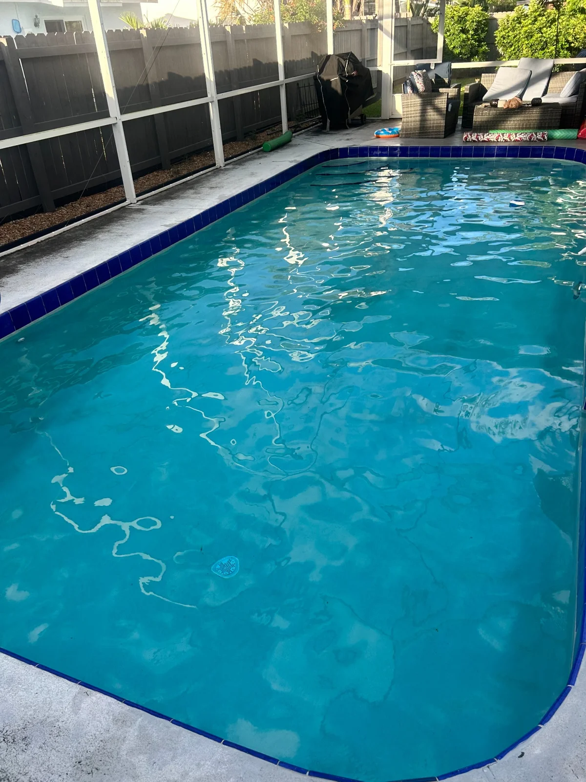 Clear water in a screened pool